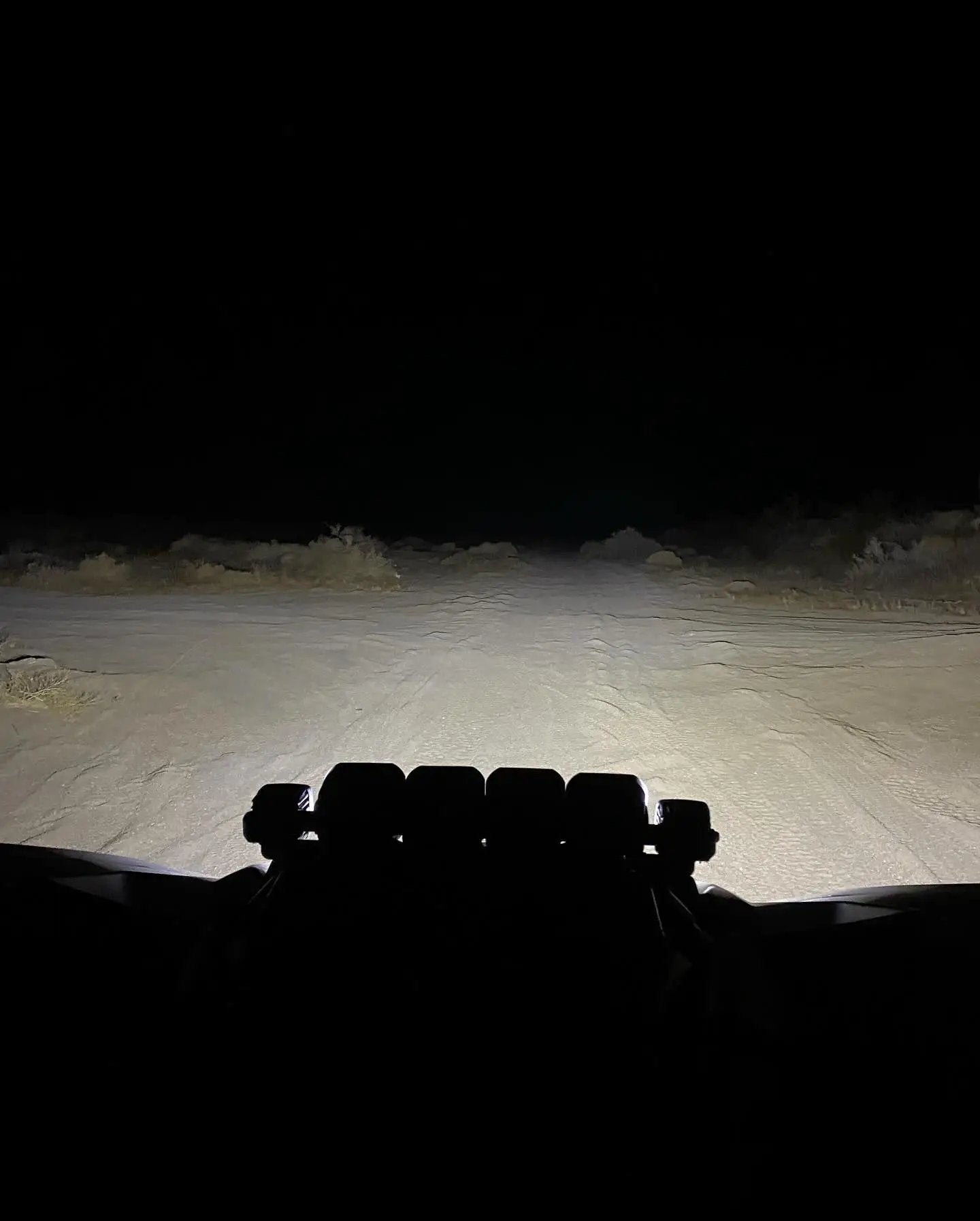 Can-Am X3 shock-tower LED light bar with pods by GGLighting on night desert trail on Tampa Home & Garden Store