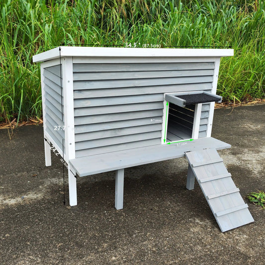 Outdoor cat house with escape door, white trim, gray wooden siding, porch deck ramp on Tampa Home & Garden Store