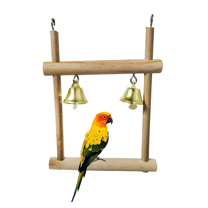 Natural solid wood stand with two brass bells and a colorful parrot perched on the base on Tampa Home & Garden Store