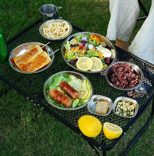 Outdoor stainless steel dinner plate set 17 piece with mixed bowls on a metal picnic table on Tampa Home & Garden Store