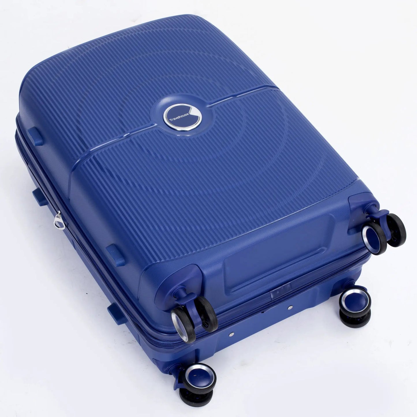 Expandable navy hardshell suitcase with Travelhouse logo and ribbed exterior on Tampa Home & Garden Store