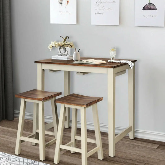 Counter height pub table with 2 saddle stools, cream frame and brown wood tops on Tampa Home & Garden Store