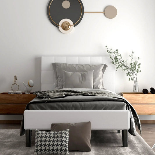 White platform bed with button-tufted headboard and grey bedding, modern bedroom setup on Tampa Home & Garden Store