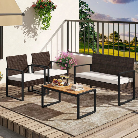 4-piece outdoor rattan set with cushioned white chairs and wood-plastic coffee table on Tampa Home & Garden Store