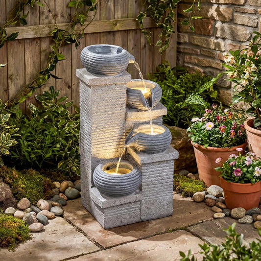 4-Tier outdoor water fountain with cascading bowls and LED lights in gray stone finish on Tampa Home & Garden Store