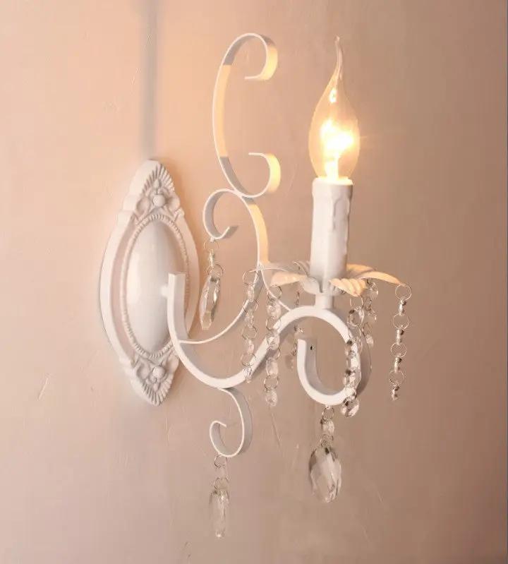 White crystal wall sconce with LED candle bulb by Decorbites on Tampa Home & Garden Store