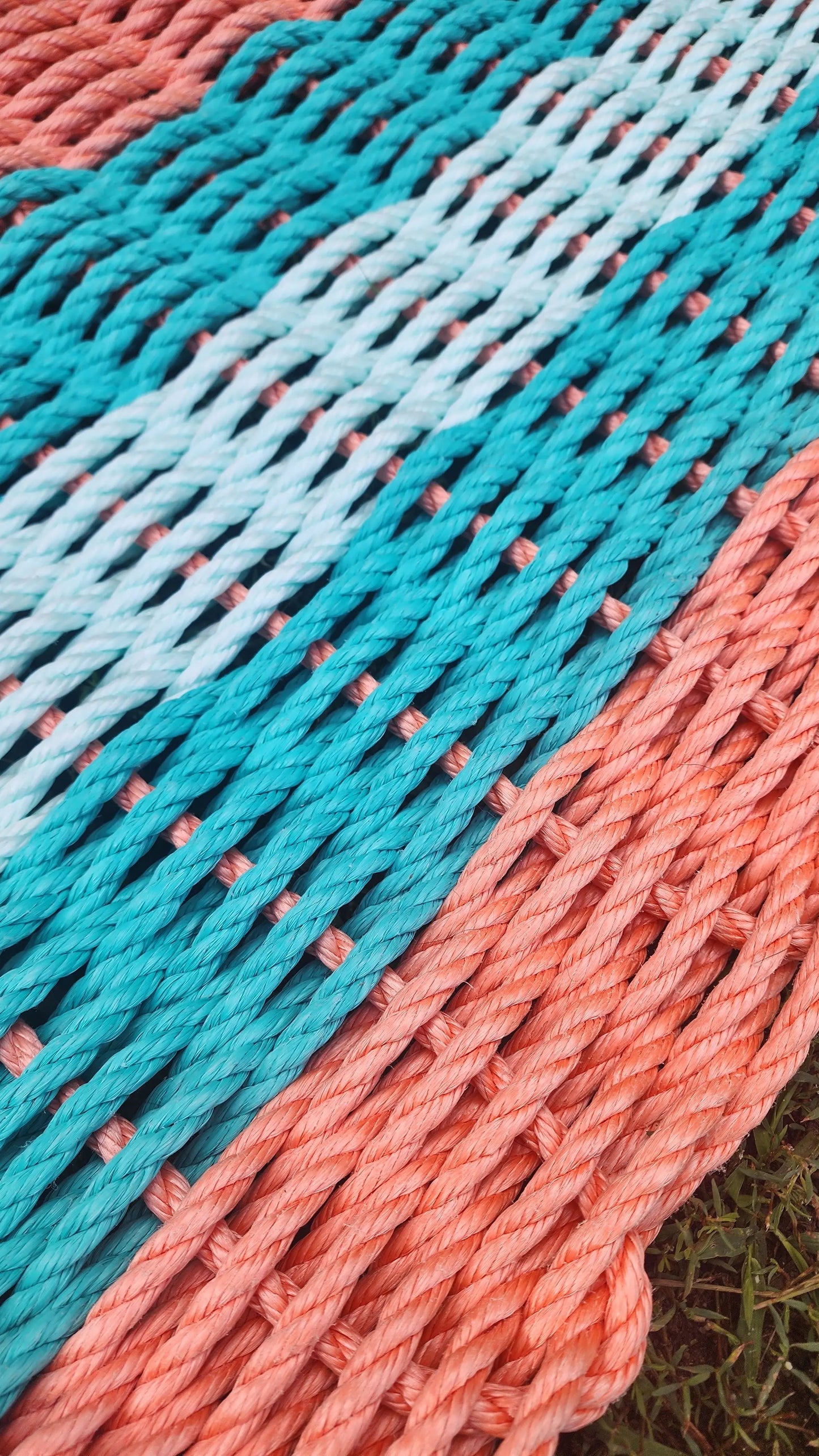Lobster Rope Mat in orange teal and seafoam, handmade rope rug by Little Salty Rope on Tampa Home & Garden Store
