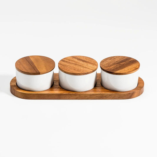 Ceramic condiment set by Kalmar Home with three white jars and wooden lids on acacia base on Tampa Home & Garden Store