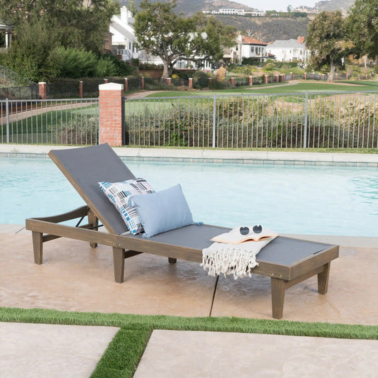 Summerland Chaise Lounge Dark Grey Mesh with wooden frame by poolside on Tampa Home & Garden Store