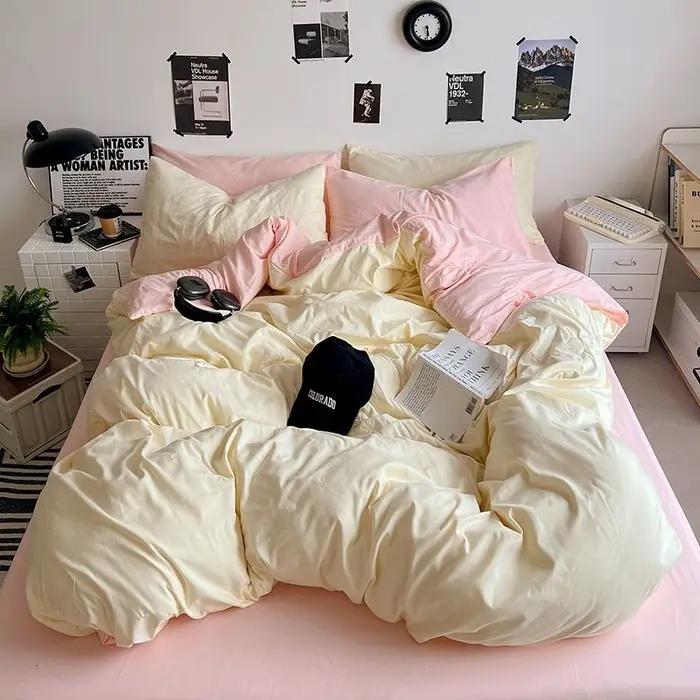 Washed Cotton Solid Color Four Piece Bedding Set in cream and pink on bed with pillows on Tampa Home & Garden Store