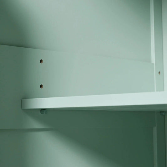 Mint green wall with horizontal shelf rails and peg holes on Tampa Home & Garden Store