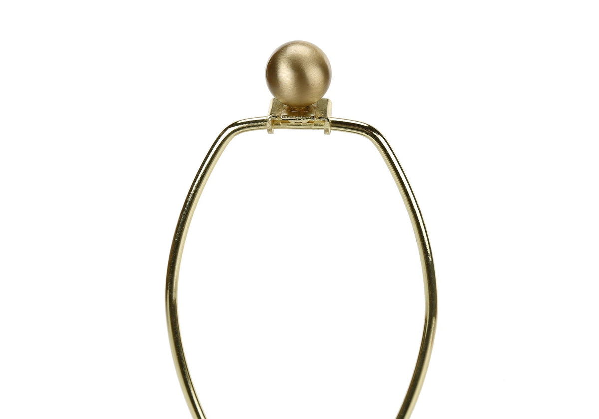 Table lamp base with a gold-tone curved metal frame and spherical finial on top on Tampa Home & Garden Store