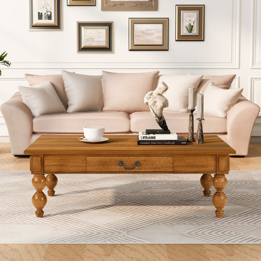 Rectangular oak coffee table with storage drawer and turned legs blush sofa and books on Tampa Home & Garden Store