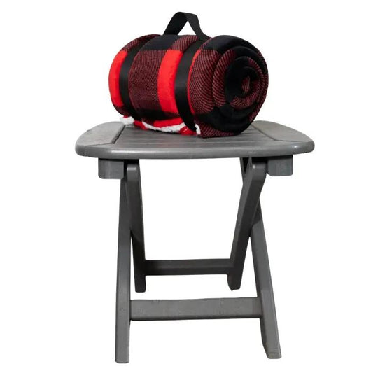 Red Buffalo Plaid Sherpa Throw Blanket City Bonfires rolled on a gray outdoor stool on Tampa Home & Garden Store