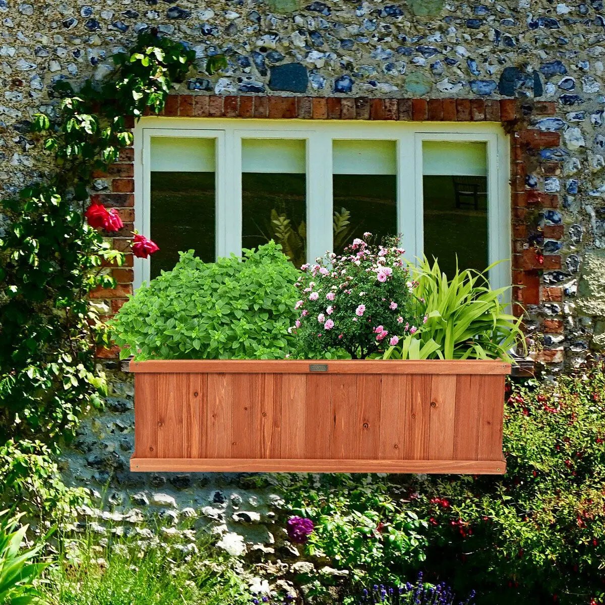 Wooden window planter box in reddish-brown with green foliage and pink blooms DirectDeals on Tampa Home & Garden Store