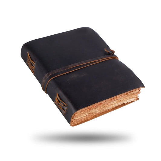 Ralph Waldo Full Grain Buffalo Leather Journal with black cover and tan wrap strap on Tampa Home & Garden Store