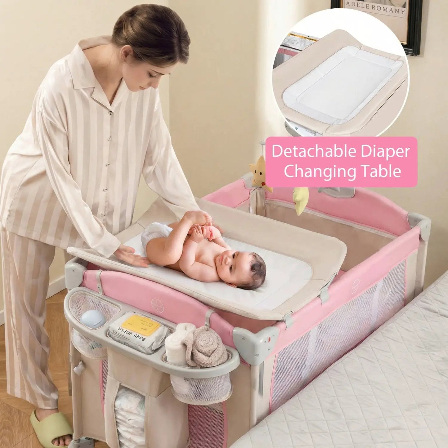 5-in-1 Portable Pack Play Diaper Changing Table pink bassinet playard with baby on changing surface on Tampa Home & Garden Store