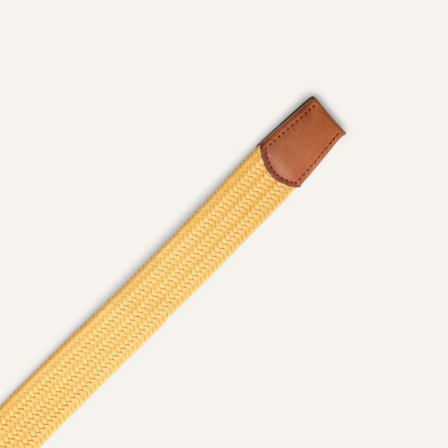 Tubular Italian stretch web belt with brown leather end cap and woven tan body on Tampa Home & Garden Store