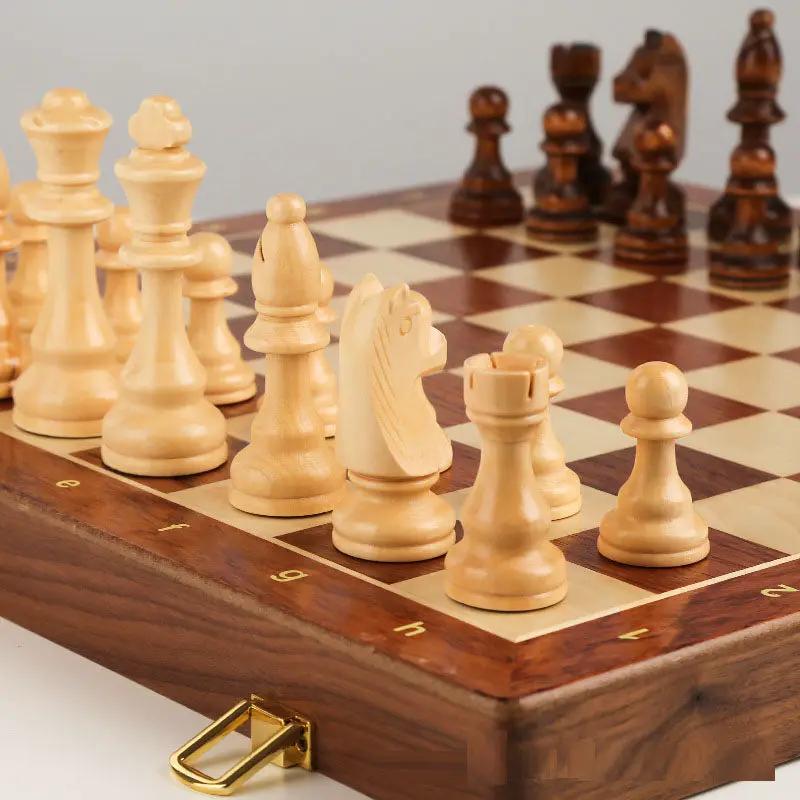 Solid wood chess set with large folding board; light wood pieces on a two-tone board on Tampa Home & Garden Store