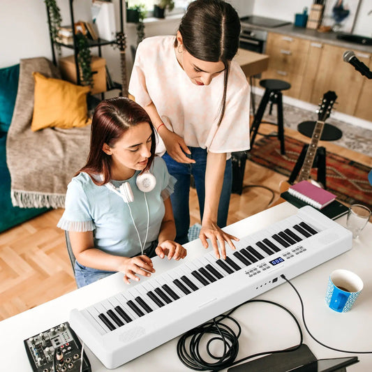 DirectDeals 61-key foldable piano keyboard MIDI with split, white finish, used by two people on Tampa Home & Garden Store