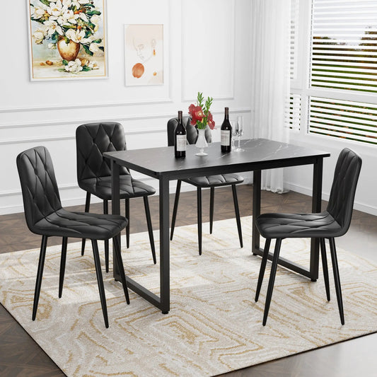 Dining Chairs Set of 4 in black PU around black dining table in a modern dining room on Tampa Home & Garden Store