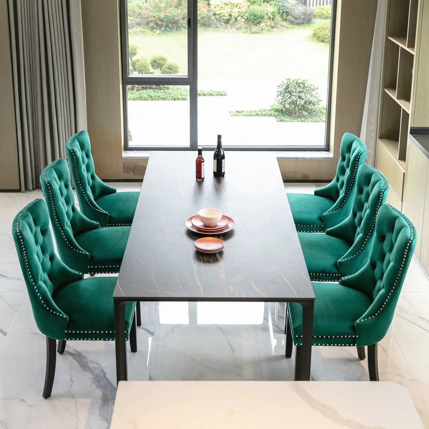 Green Velvet Tufted Dining Chairs around a dark table in a bright dining room, six chairs on Tampa Home & Garden Store