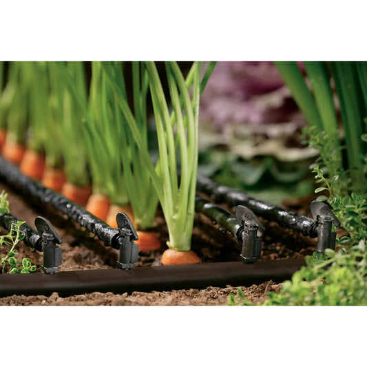Orbit Quarter Inch Barb 1 GPH Drip Flag Dripper Pack in garden bed with black drip tubing on Tampa Home & Garden Store