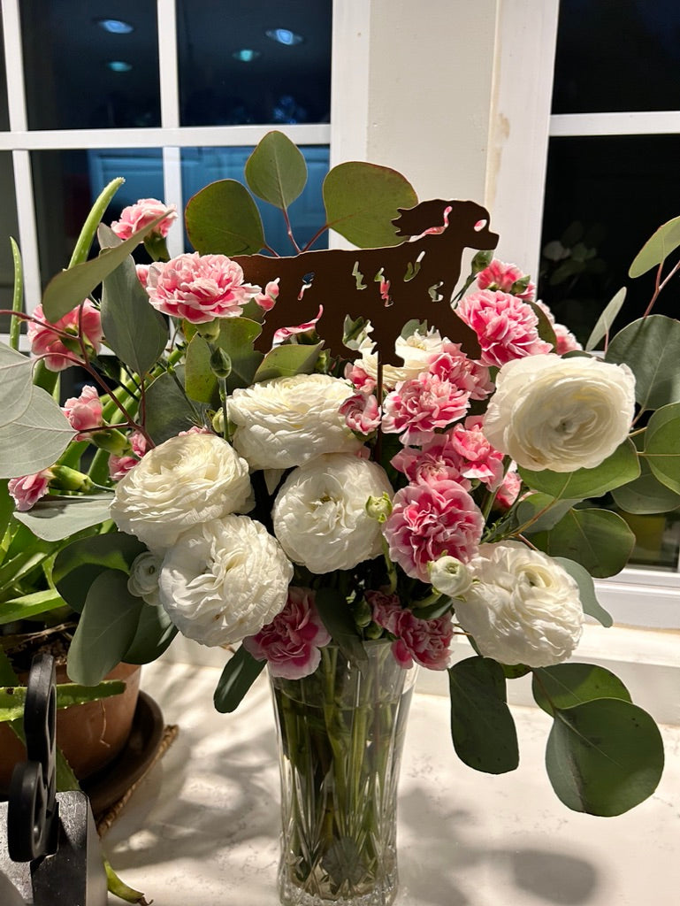 Cavalier King Charles Spaniel plant stake silhouette in brown metal among ranunculus on Tampa Home & Garden Store
