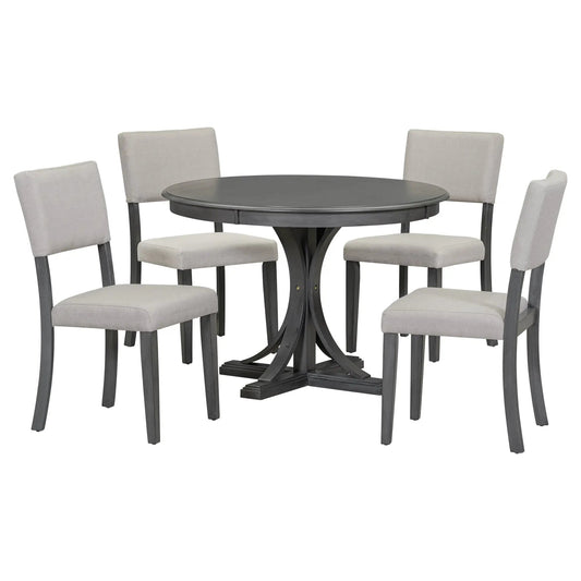 Retro round dining table set with six cushioned gray chairs and black metal base on Tampa Home & Garden Store