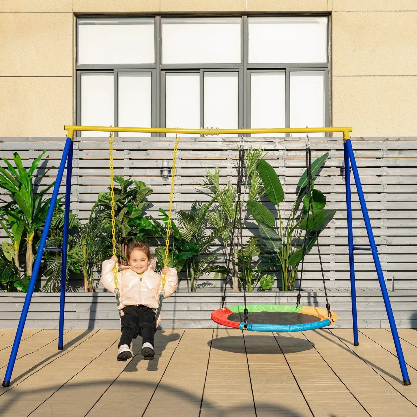 660 Lbs Extra-Large A-Shaped Swing Stand Yellow with blue legs and two swings, child on one, on Tampa Home & Garden Store