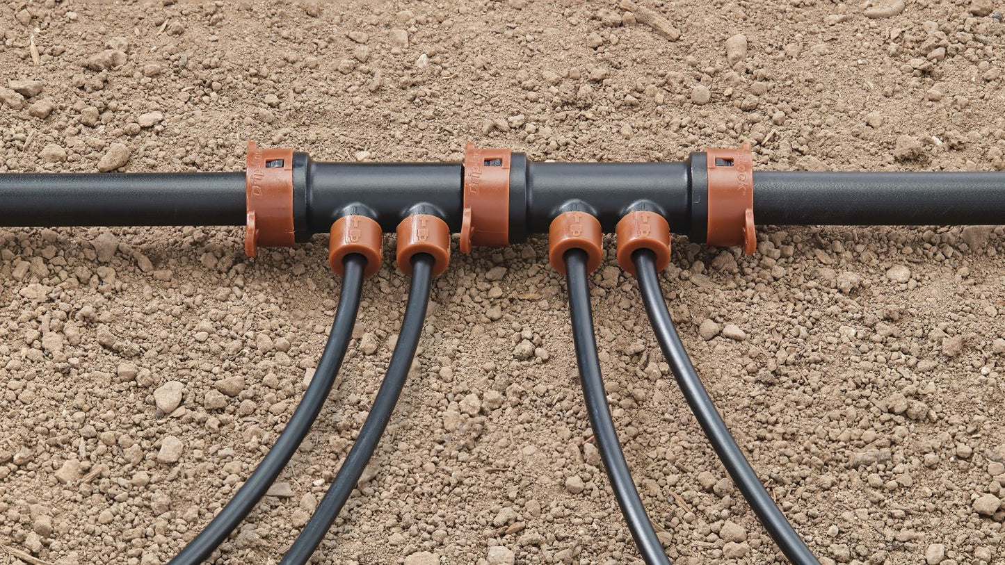 Drip-Lock 2-Port Extension Manifold 1/2 to 1/4 orange fittings on black tubing on Tampa Home & Garden Store