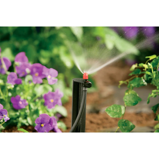 Quarter inch barb micro sprinkler on stake with red top watering vibrant flowers on Tampa Home & Garden Store