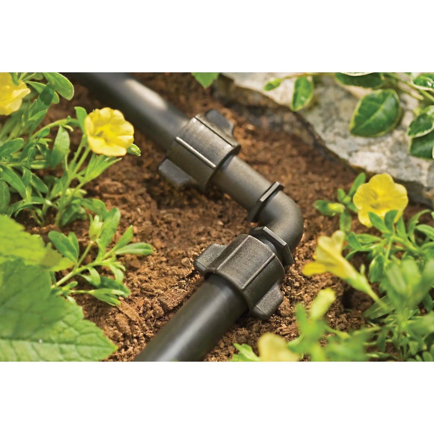 Half Inch Universal Drip Elbow for Tubing black plastic irrigation fitting on Tampa Home & Garden Store