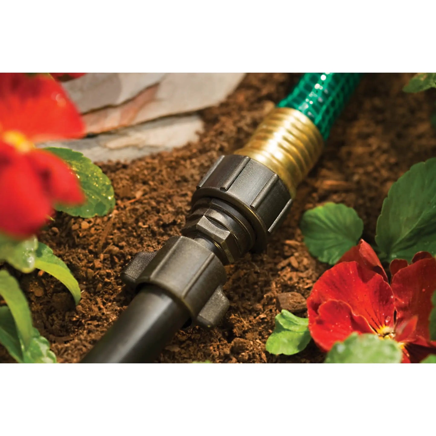 Orbit Irrigation half-inch universal drip to hose faucet adapter on black plastic on Tampa Home & Garden Store