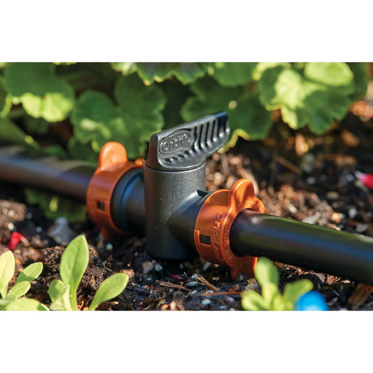 Half-inch Drip-Lock push-fit coupling with valve by Orbit, black body, orange accents on Tampa Home & Garden Store