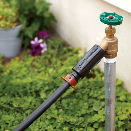 DripLock 3-in-1 filter and regulator adapter by Orbit on green brass irrigation valve on Tampa Home & Garden Store