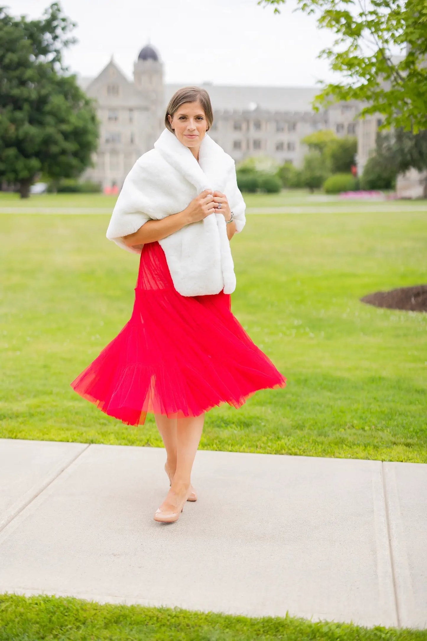 Waterproof Windproof Capelet by Pretty Rugged in white faux fur worn over red dress on Tampa Home & Garden Store