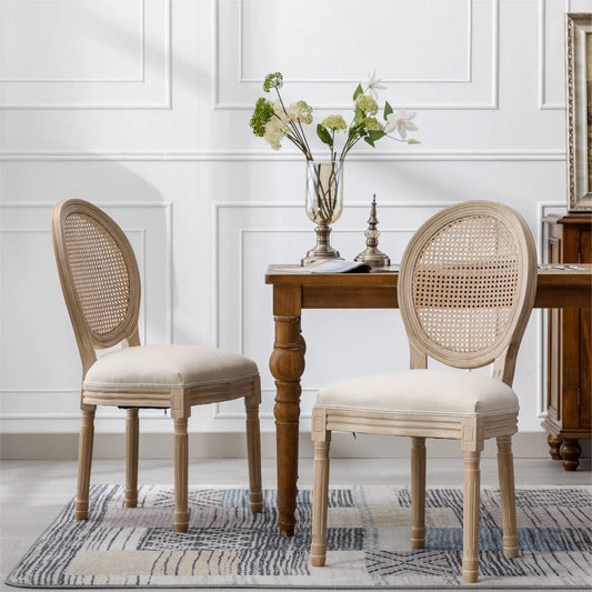 Cream French-style solid wood dining chair with cane back; set of two around a wooden table on Tampa Home & Garden Store