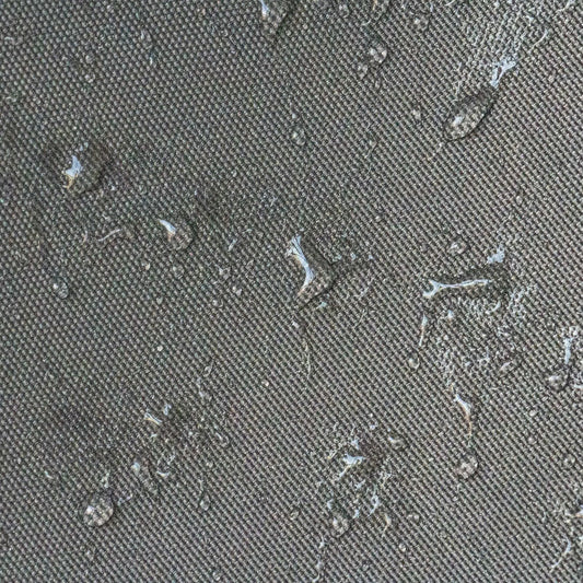 Universal canopy cover fabric close-up showing dark woven texture with debris on Tampa Home & Garden Store