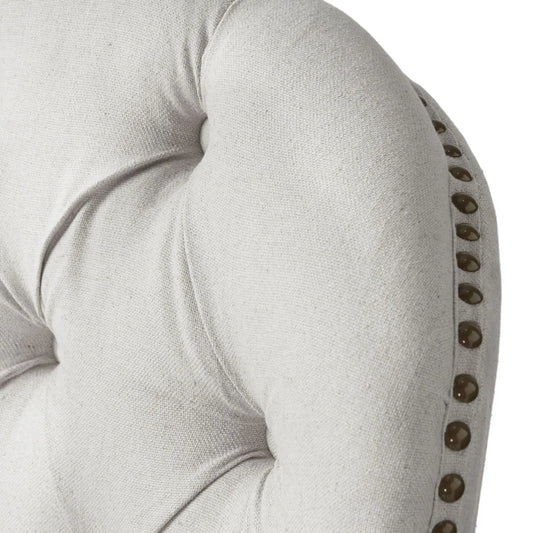 Light gray fabric club chair and ottoman set arm with a row of dark brown buttons on Tampa Home & Garden Store