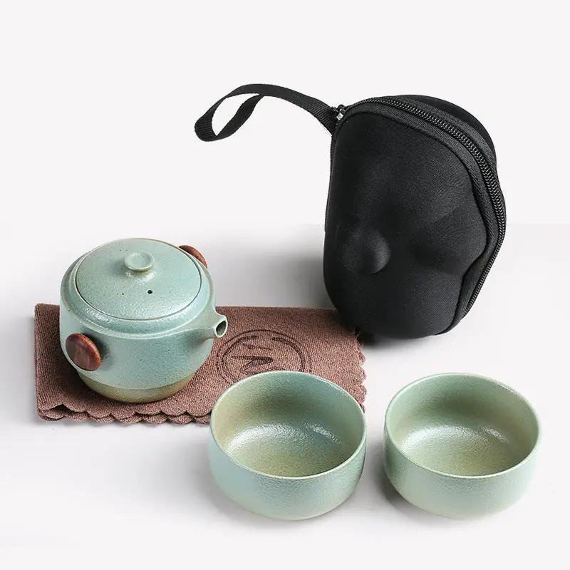 Juego de té portátil de cerámica negra de viaje al aire libre para el hogar con una taza de invitado rápida, una tetera y dos tazas, bolsa portátil Kung Fu, burbuja portátil para exteriores.
