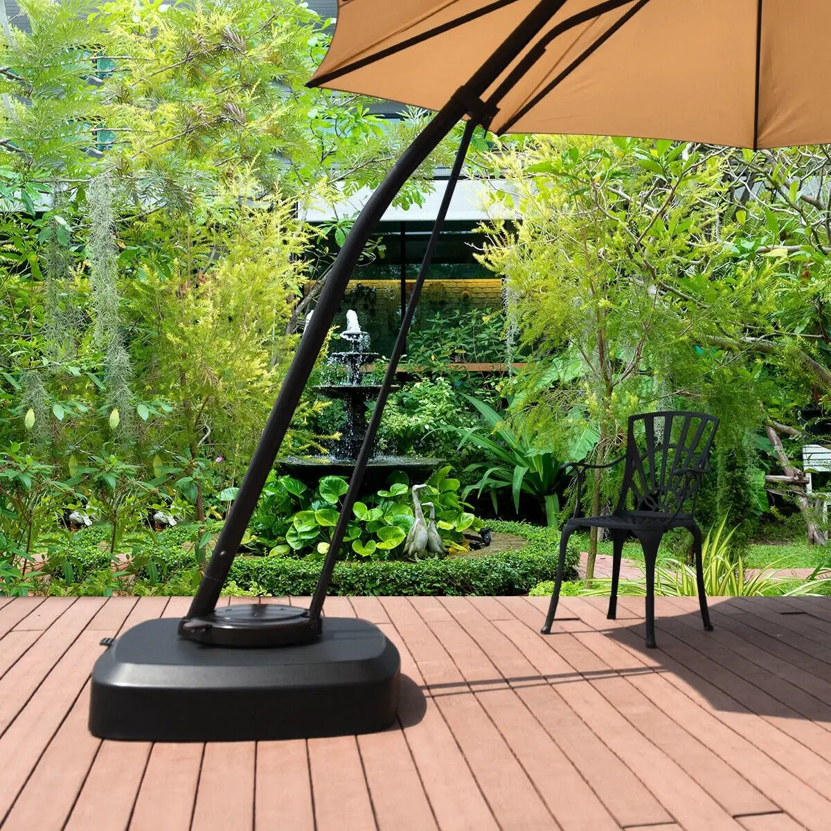 Patio Cantilever Offset Umbrella Base with Wheels, black base and tan canopy on wooden deck on Tampa Home & Garden Store