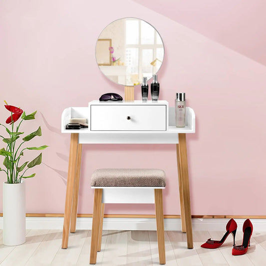 Wooden makeup dressing table with round mirror, white drawer, and wooden legs against pink wall on Tampa Home & Garden Store