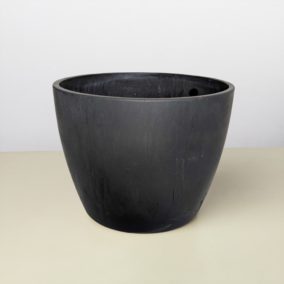 Black eco pot with rounded wide rim and matte finish on Tampa Home & Garden Store