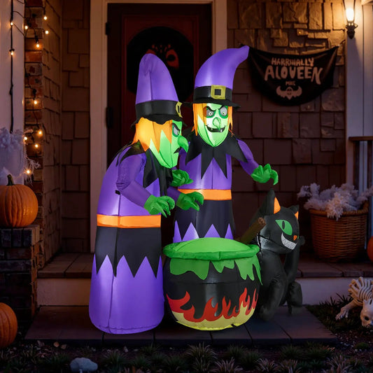 Inflatable Halloween Witches With Cauldron Cat display featuring two purple witches on Tampa Home & Garden Store