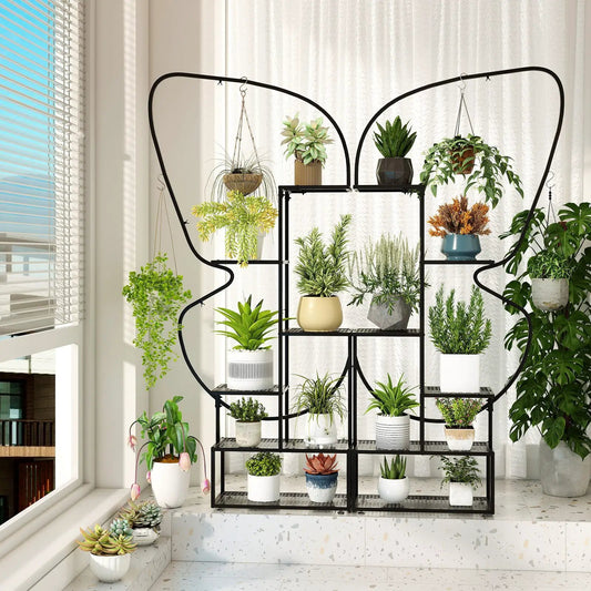Six-tier black metal plant stand ladder rack with hooks and a variety of potted plants on Tampa Home & Garden Store