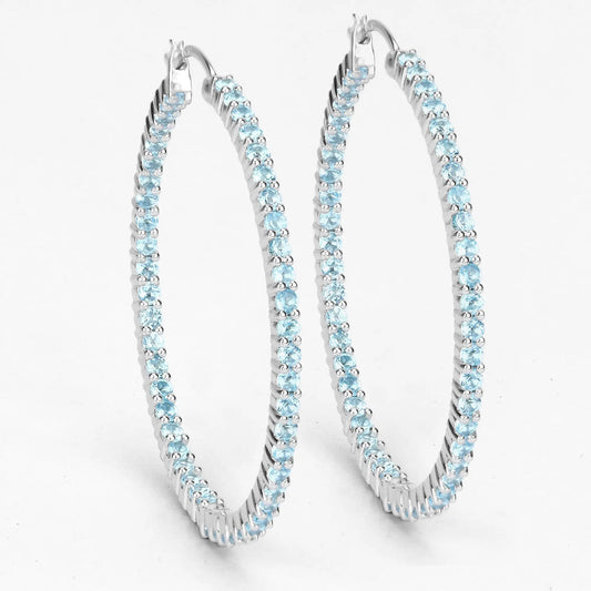 Three sterling silver hoop earrings set with genuine Swiss blue topaz stones on Tampa Home & Garden Store