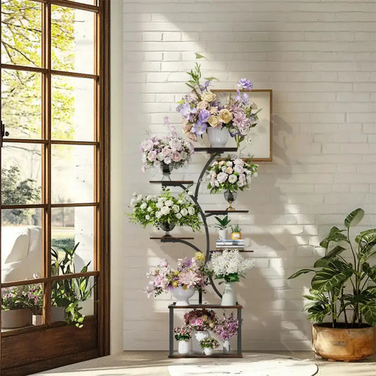 Decorbites Modern Black Metal Plant Stand 7-Tier Rack with floral arrangements indoor by window on Tampa Home & Garden Store