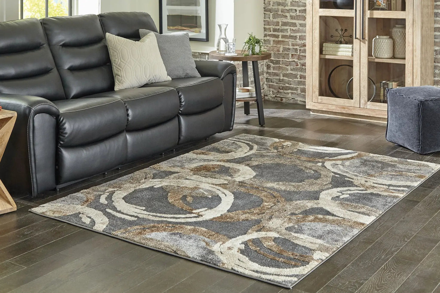 Faelyn Area Rug by Unique Piece Furniture in gray cream abstract swirl on dark wood floor on Tampa Home & Garden Store