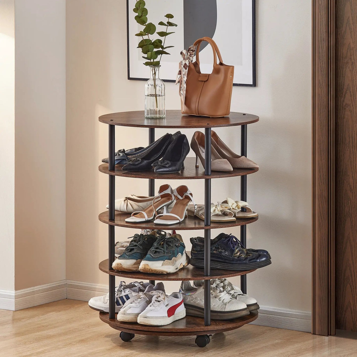 Four-tier shoe rack with wood shelves, black frame on casters, tan handbag and glass vase on Tampa Home & Garden Store